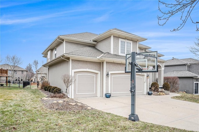 view of front property with a garage and a front lawn