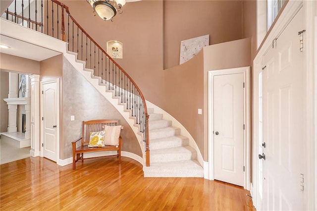 entrance foyer featuring a high ceiling and hardwood / wood-style floors