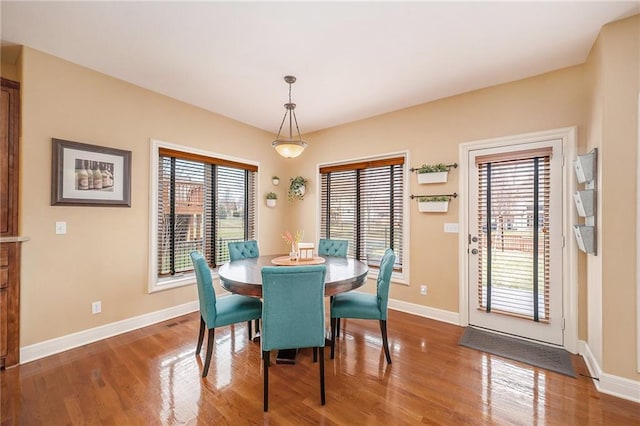 dining area with hardwood / wood-style floors and plenty of natural light