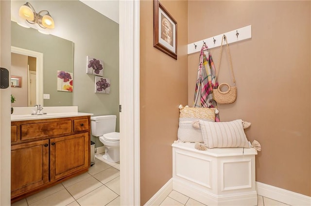 bathroom with vanity, tile patterned floors, and toilet