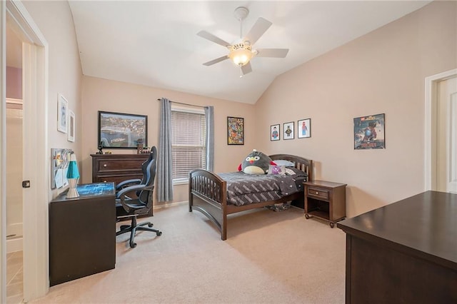 bedroom with ceiling fan, light colored carpet, and lofted ceiling