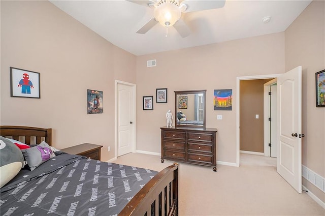 carpeted bedroom with vaulted ceiling and ceiling fan