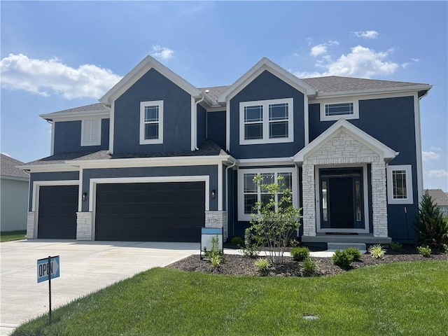 view of front facade featuring a garage and a front lawn