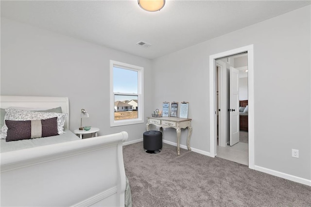 bedroom featuring light colored carpet