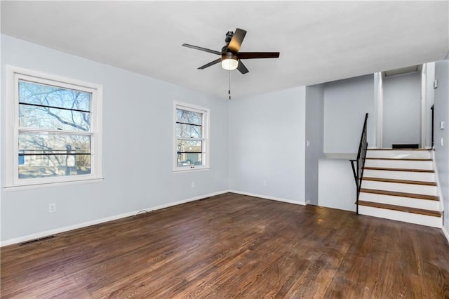 unfurnished living room with ceiling fan and dark hardwood / wood-style floors