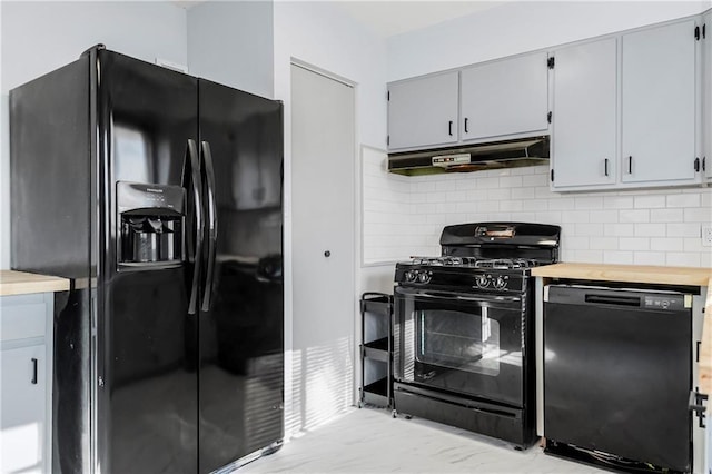 kitchen featuring black appliances, wood counters, gray cabinets, and tasteful backsplash