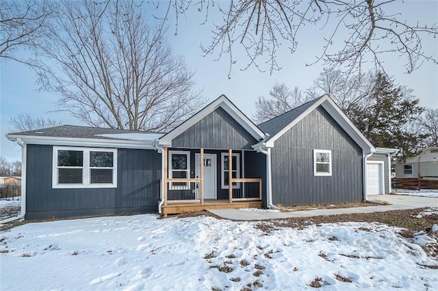 view of front of house featuring covered porch and a garage