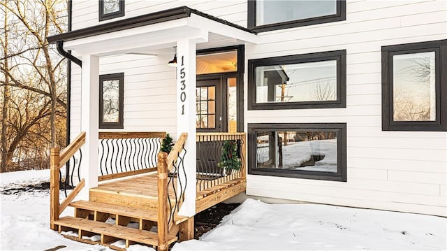 view of snow covered property entrance