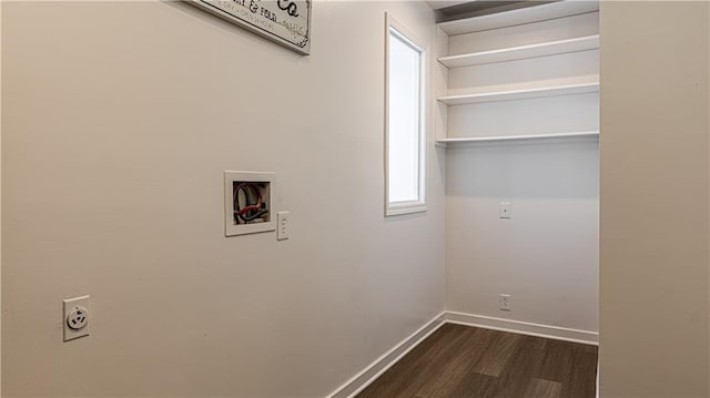 laundry room featuring dark hardwood / wood-style floors, hookup for a washing machine, and electric dryer hookup