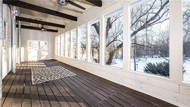 unfurnished sunroom featuring wood ceiling and vaulted ceiling with beams