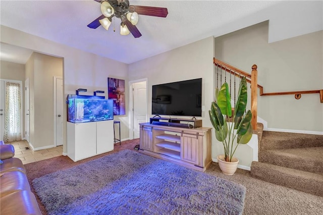 carpeted living room with ceiling fan