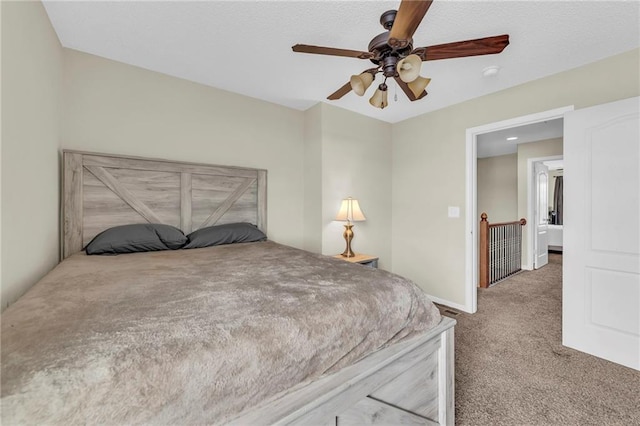 bedroom featuring ceiling fan and carpet