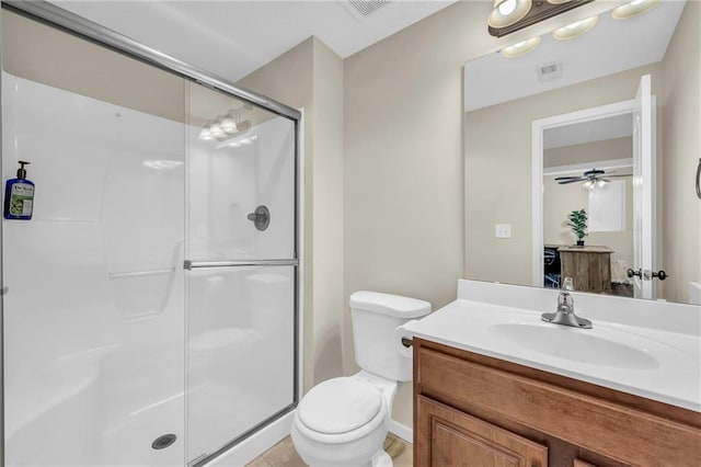 bathroom with vanity, toilet, and an enclosed shower