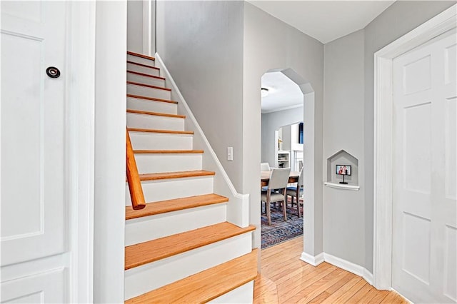 staircase with hardwood / wood-style flooring