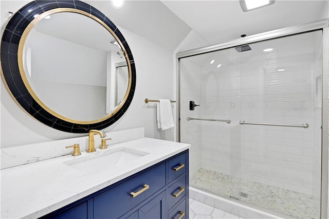 bathroom featuring walk in shower and vanity