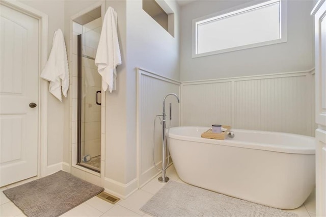 bathroom with tile patterned flooring and plus walk in shower