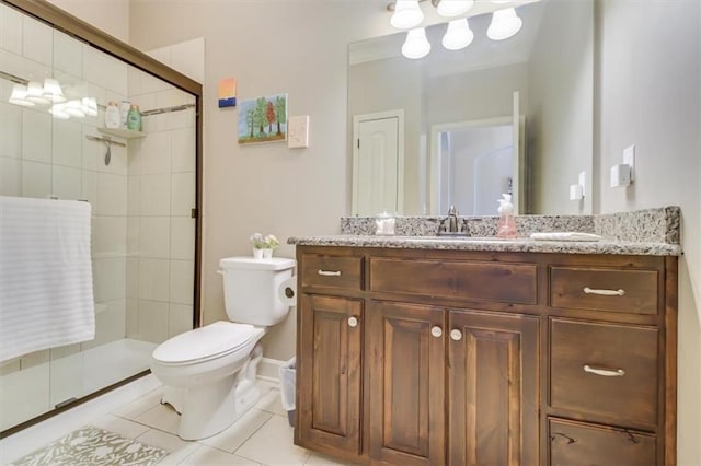 bathroom featuring vanity, tile patterned floors, toilet, and walk in shower