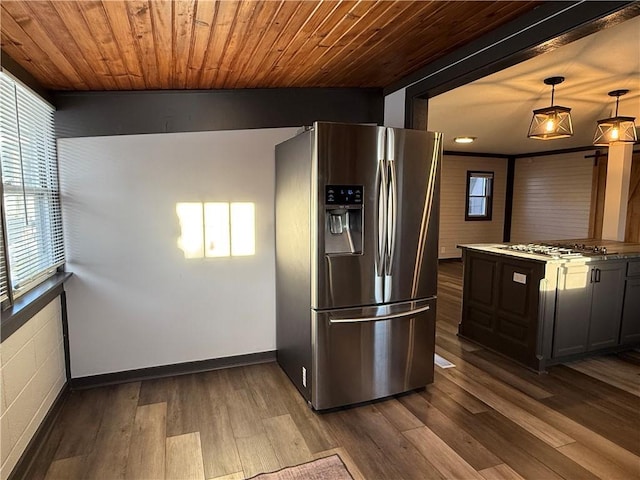 kitchen featuring pendant lighting, dark hardwood / wood-style flooring, wooden ceiling, and appliances with stainless steel finishes