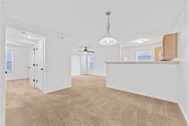 carpeted spare room with a wealth of natural light