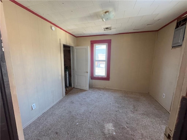 carpeted empty room featuring ornamental molding