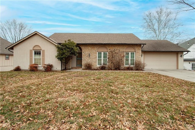 ranch-style home featuring a garage and a front lawn