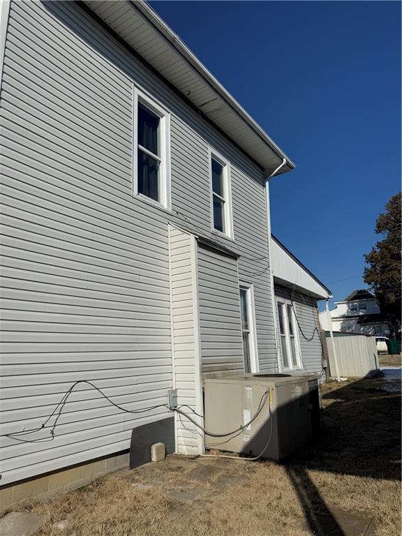 view of home's exterior with cooling unit