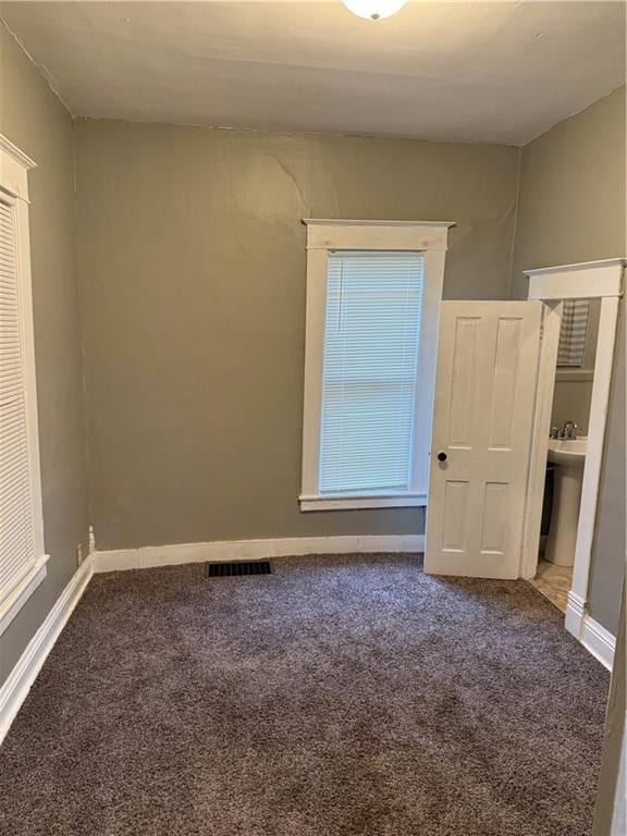 2901 Messanie St, Saint Joseph, MO 64501 - spare room featuring carpet and baseboards