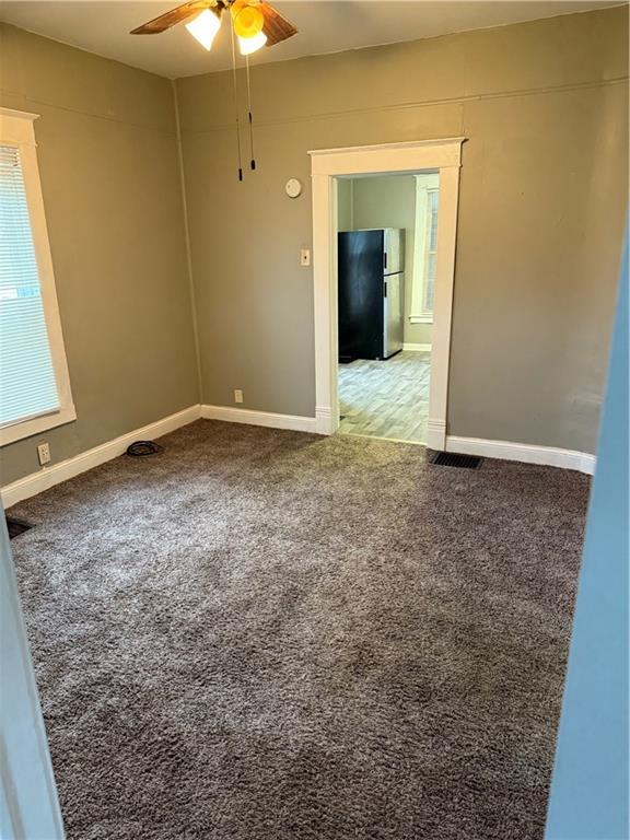 2901 Messanie St, Saint Joseph, MO 64501 - carpeted empty room featuring ceiling fan and baseboards