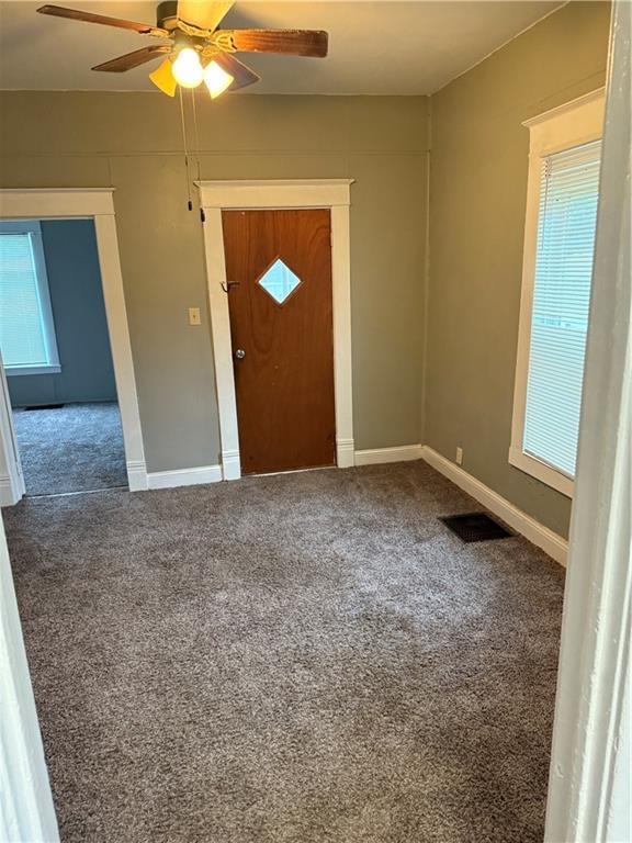 2901 Messanie St, Saint Joseph, MO 64501 - carpeted foyer featuring ceiling fan and baseboards