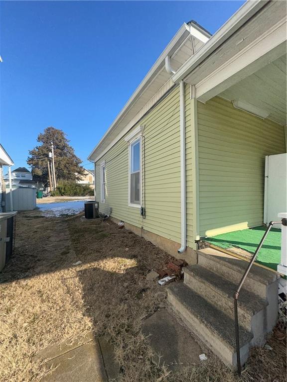 view of property exterior featuring central air condition unit