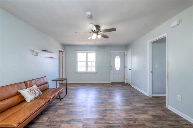 foyer entrance with wood finished floors, a ceiling fan, and baseboards