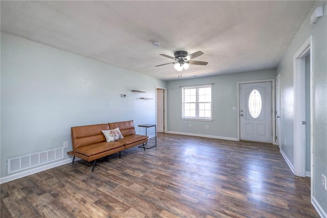 entryway featuring a ceiling fan, baseboards, visible vents, and dark wood-type flooring