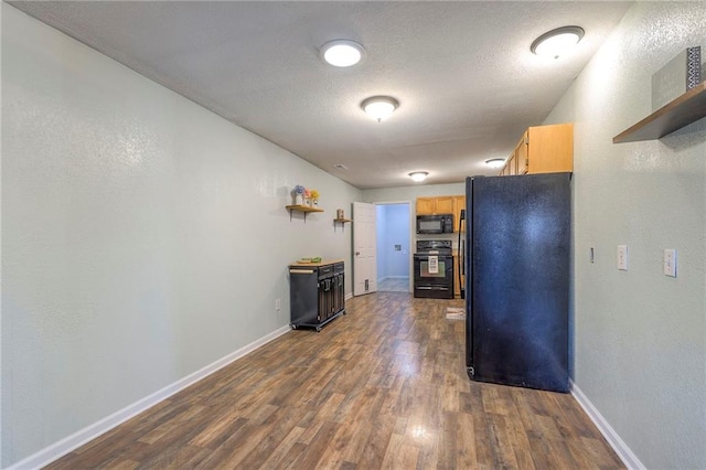 kitchen featuring a textured ceiling, open shelves, baseboards, black appliances, and dark wood finished floors