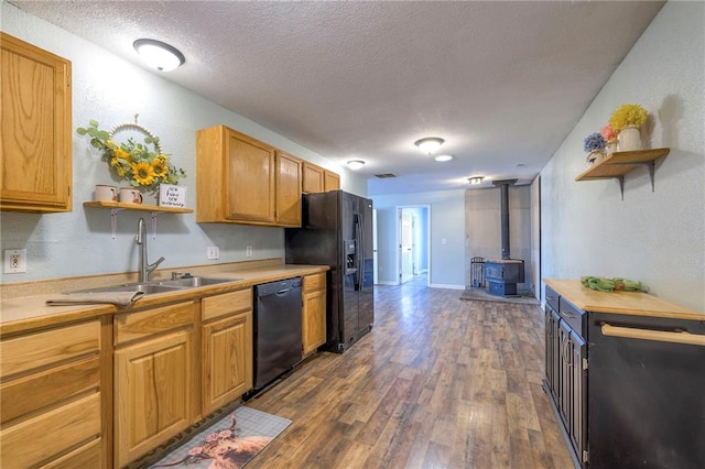 kitchen featuring black appliances, dark wood-style floors, open shelves, and a sink