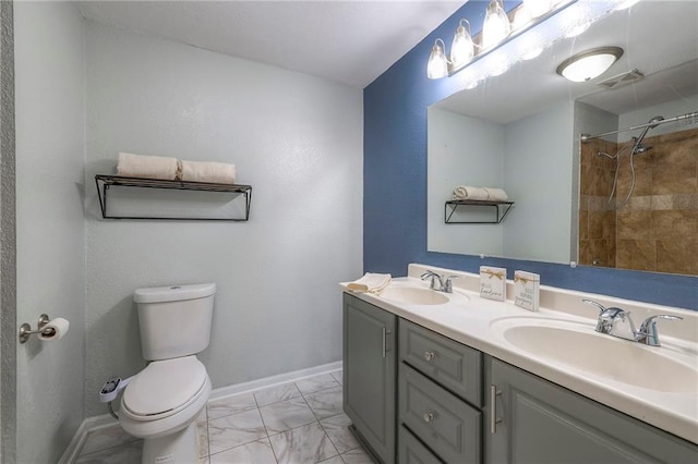 full bathroom with toilet, marble finish floor, visible vents, and a sink