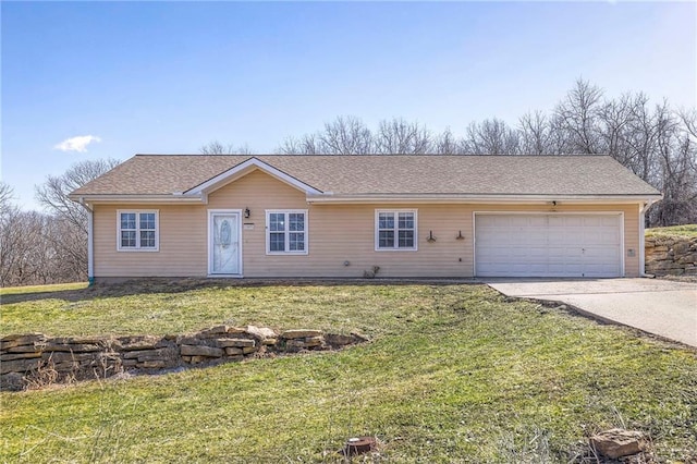 ranch-style house with concrete driveway, a shingled roof, an attached garage, and a front yard