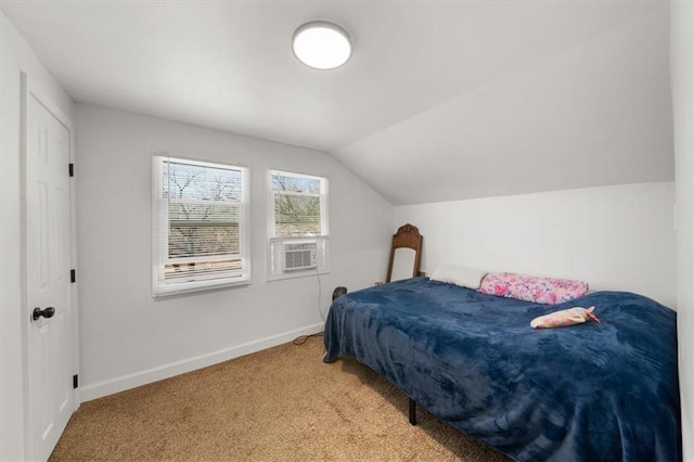 bedroom featuring carpet floors, cooling unit, vaulted ceiling, and baseboards