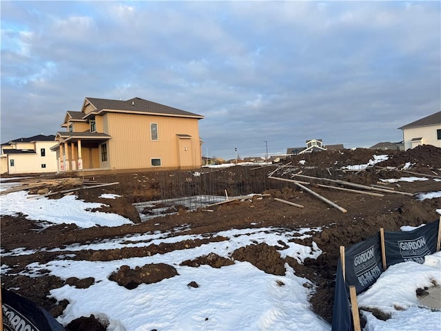 view of yard layered in snow