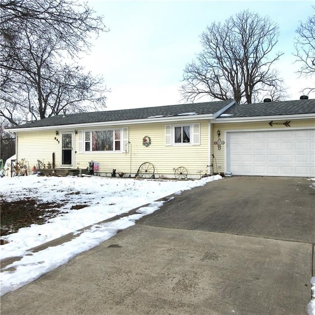 ranch-style house featuring a garage