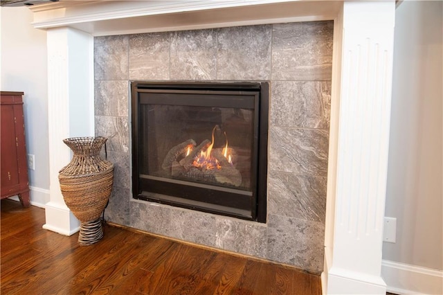 room details with a fireplace and hardwood / wood-style floors