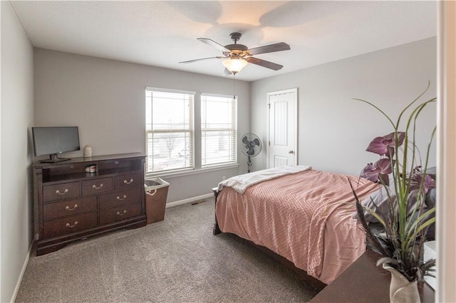 bedroom with ceiling fan and carpet