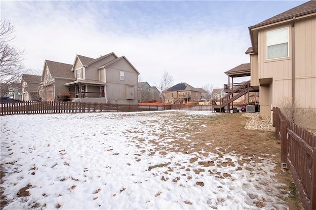 view of yard layered in snow