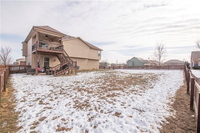 yard covered in snow with ceiling fan