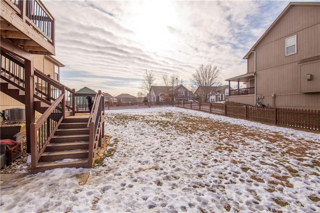 yard covered in snow with central AC unit