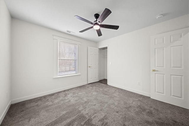 unfurnished bedroom featuring ceiling fan and carpet flooring