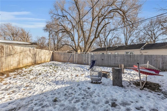 view of yard layered in snow