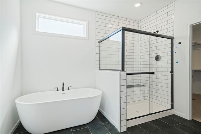 bathroom featuring tile patterned floors and plus walk in shower