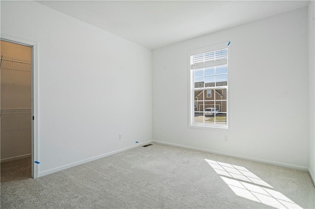 spare room with light carpet