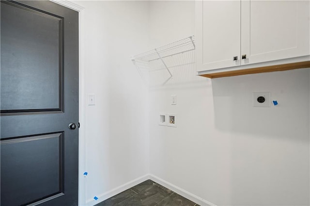 washroom with washer hookup, electric dryer hookup, and cabinets