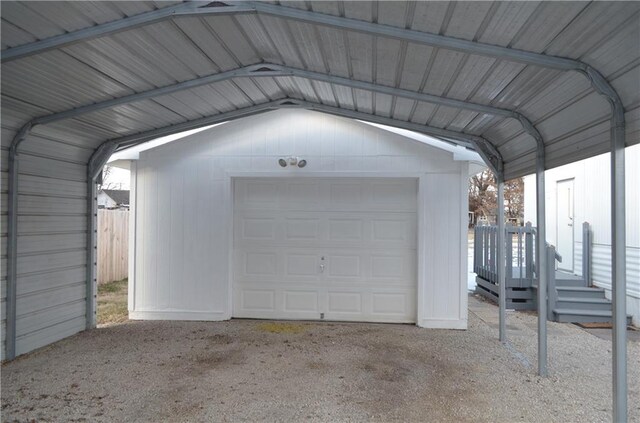 garage featuring a carport